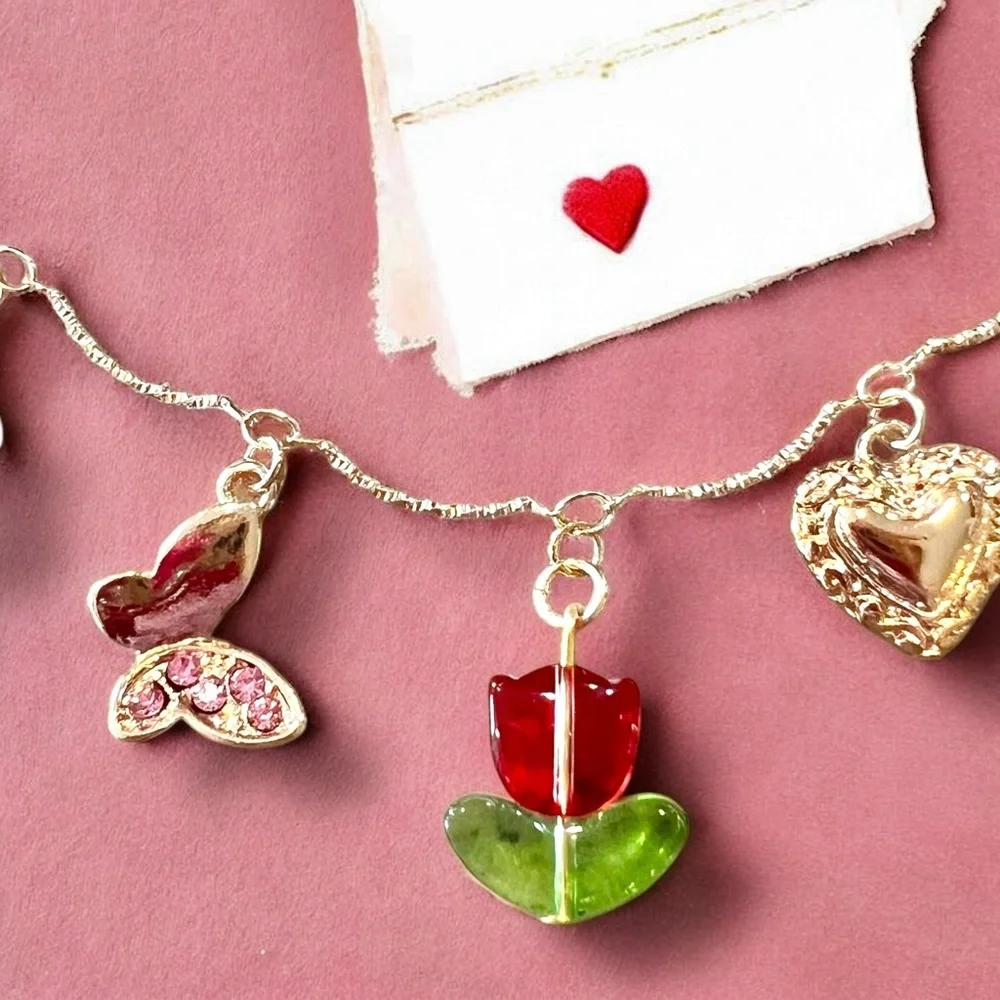 Gold and Red toned Charm Necklace glass rhinestones enamel tulip flower hearts